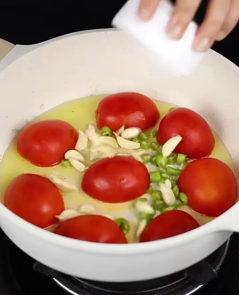 Sauté the Garlic and Tomatoes